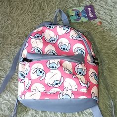 Nwt Super Cute Pink/Blue Disney Stitch Mini Backpack. Cute Pink Backpack For Disney Trips, Cute Bags For Disney Trips, Pink Backpack For Disney Trips With Zipper Closure, Pink Backpack With Zipper Closure For Travel, Pink Bags With Zipper For Disney Trips, Pink Bags With Zipper Closure For Disney Trips, Nightmare Before Christmas Backpack, Disney Boutique, Canvas Drawstring Backpack