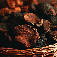 a wicker basket filled with brown and black rocks