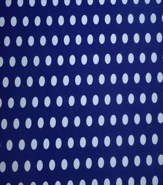 a blue background with white polka dots