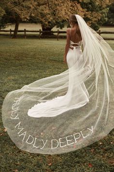 a woman in a wedding dress with a veil on her head and the words marry deeply written on it