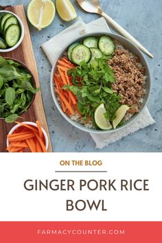 a bowl filled with rice, carrots and cucumbers