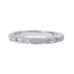 a white gold band with baguetts and diamonds