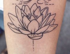 a black and white photo of a lotus flower on the leg with sun behind it