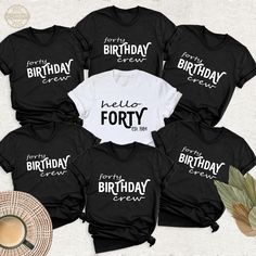 four birthday shirts with the words hello forty on them and a cup of coffee next to it