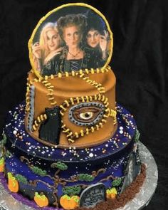 a three tiered cake with pictures on it