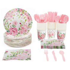 a table setting with pink flowers and napkins, plates, forks and utensils