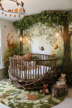 a baby's room with a tree mural on the wall and a crib