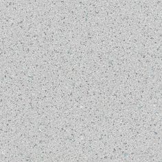 a white and gray speckled surface with small dots