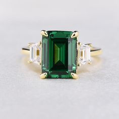 Yellow Gold Emerald Green & White Sapphire Emerald Cut Three Stone Engagement Ring In Sterling Silver Elegant Green Emerald-cut Ring, Formal Gold Emerald-cut Emerald Ring, Green Three-stone Emerald-cut Emerald Ring, Green Emerald-cut Diamond Ring For Formal Occasions, Formal Green Emerald-cut Crystal Ring, Engagement Gifts For Him, Green Diamond Rings, Emerald Wedding Rings, The Bling Ring