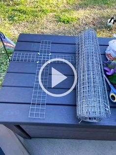 a table that has some items on top of it and is sitting in the grass