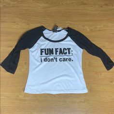 Brand New Fun Fact I Don’t Care Graphic Tee 3 Quarter Black And White Size Medium Trendy Black Top With Funny Print, Fun Black Tops With Text Print, Fun Black Top With Text Print, Casual Black Slogan Shirt, Casual Stretch Shirt With Text Print, Fun Black Long Sleeve Shirt, Fun Black Slogan Top, Fun Black Tops With Letter Print, Black Funny Print Fun Tops