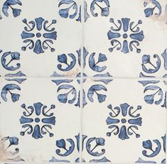 blue and white tiles with designs on them