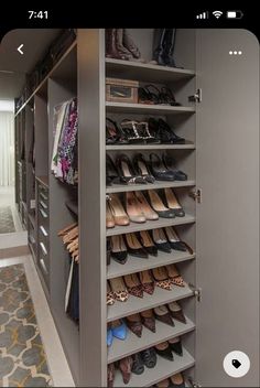 the closet is full of many pairs of shoes