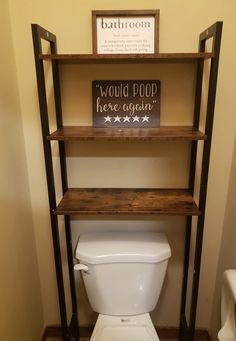 a bathroom with a toilet and shelving unit in the corner, along with a sign that says would poop here again?