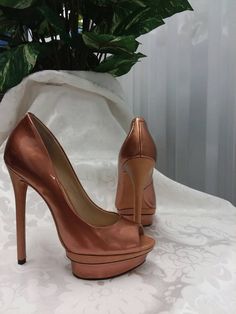 A stunning pair of shoes. Light copper metallic finish with beautiful detailing on the towering 5 inch heels and inner soles. The brand is Brian Atwood. Size 6 1/2. New w/o tags or box.  Have been tried on, but shoes like these require talent to wear. Price new was $295.00. Brian Atwood Shoes, Womens Pumps, Light Copper, Brian Atwood, Man Hat, Copper Metal, 5 Inch Heels, Womens Heels, Women's Pumps