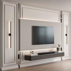 an entertainment center with a flat screen tv mounted on the wall