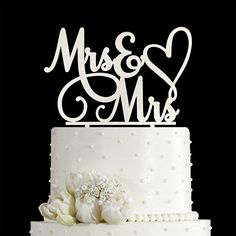 a wedding cake with the word mr and mrs on top