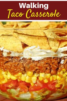 a close up of a bowl of food with tortilla chips on the side