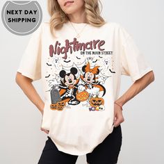 Disneyworld Nightmare On Main Street Sweatshirt, Disneyland Halloween Shirt, Halloween Mickey Minnie Pumpkin Sweater, Halloween Sweatshirt ABOUT US: -------------- ✔ Seeking personalized, comfy, and soft shirts? Express yourself with our T-shirts! With various colors, sizes, and unique designs, create a shirt that embodies you. Contact us for any queries; we'll respond promptly. HOW TO ORDER: ---------------------- ✔ To order, check the color, size, and description. Follow these steps: * Select Disney Halloween T-shirt Pre-shrunk, Disney Halloween Graphic Print T-shirt, Disney Halloween Fan Merchandise T-shirt, Disney Halloween T-shirt With Character Print, Disney Halloween Character Print T-shirt, Disney Halloween T-shirt For Fan Events, Disney Halloween Themed T-shirt, Themed T-shirt For Disney Halloween Events, Disney Crew Neck Top For Halloween