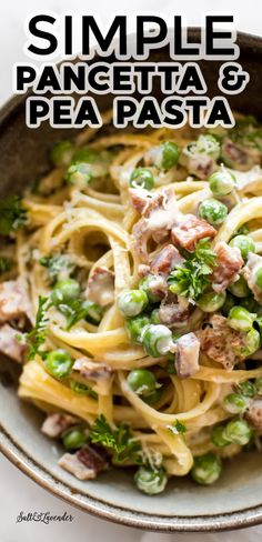 a bowl filled with pasta and peas on top of a table