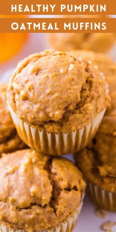 healthy pumpkin oatmeal muffins stacked on top of each other