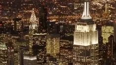 an aerial view of new york city at night from the top of the empire building