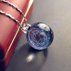 After purchase, send the phone number to me because the post office needs it so that it can be reached fasterThe variation is the color of the bottomPlease choose PayPal to pay when you purchase, otherwise you can't payGlass pendant measures approximately 0.86-0.95" (2.2-2.4 cm) in diameter. 1.2"(3 cm) in heightThe glass pendant comes with a brown cord . (Adjustable the length of black cord via he woodenbead.) This charming necklace will arrive at your home securely nestled come in a gift box an Seni Resin, قلادات متدلية, Dream Meaning, Jewellery Shops, Galaxy Pendant, Magical Jewelry, A Necklace, Fantasy Jewelry, Girly Jewelry