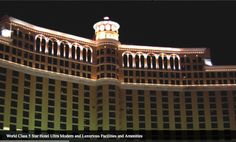 the las vegas hotel and casino is lit up at night with lights on it's side