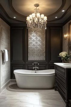 a bathroom with a tub, chandelier and sink