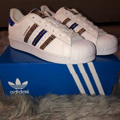 Custom Superstar Adidas Size 6 Original Color: White Base/ Royal Blue Stripes Customized With Blue And Gold Swarovski Crystals Brand New ; Tags Still Attached Box Included Girls Soccer Cleats, Mickey Mouse Shoes, Superstar Adidas, Adidas Yung, Adidas Tubular Shadow, Adidas Swift Run, White Tennis Shoes, Shoes Custom, Adidas Girl