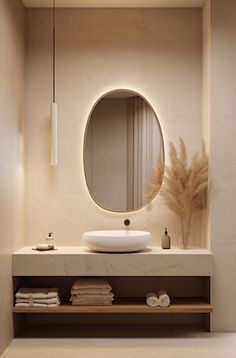 a bathroom with a sink, mirror and towel rack on the counter next to it