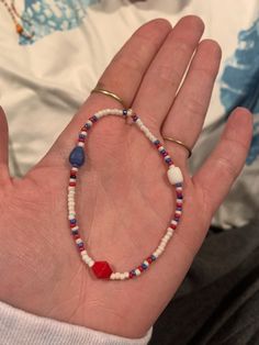 "Handmade \"USA\" bracelet with red, white and blue! Now you can show your patriotism in style with a comfy elastic bracelet. One size fits all (can customize smaller for children) and materials are extremely durable and longlasting! I wear mine 24/7 and haven't had one break yet!  *I am open to all color (I have almost every) and pattern requests, please feel free to message me :)" Patriotic Blue Bracelets For Beach, Blue Adjustable Stretch Bracelet For 4th Of July, Patriotic Jewelry For 4th Of July Beach Occasion, Patriotic Jewelry For 4th Of July Beach Events, Patriotic Jewelry For 4th Of July Beach, Patriotic Jewelry For Beach On 4th Of July, Patriotic Blue Beaded Stretch Bracelet, Patriotic Round Beads Stretch Bracelet For 4th Of July, Blue Beaded Patriotic Stretch Bracelet