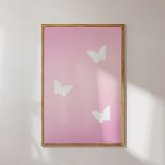 a pink wall with white butterflies on it