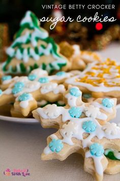 several decorated cookies on a plate with the words vintage betty crocker sugar cookies