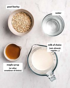 ingredients to make oatmeal smoothie on a marble counter top with labeled labels