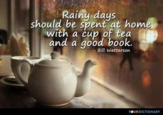 a teapot and cup on a table with a quote about rainy days should be spent at home with a cup of tea and a good book