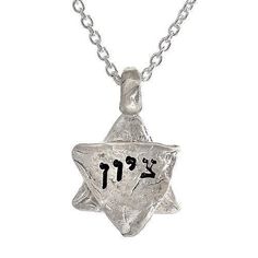 Description and Details ציון TZION Zion Zion is often used as a synonym for Jerusalem. Sterling silver charm imprinted with texture from the stones of the Western Wall in Jerusalem. Inscribed in Hebrew Pendant size is 5/8″ (20mm) Chain length 16″ (42cm) 63 x .63 in HWN2B Symbolic Sterling Silver Star Charm Necklace, Sterling Silver Symbolic Necklace With Star Charm, Symbolic Stamped Necklace For Anniversary, Sterling Silver Star Of David Charms Jewelry, Symbolic Charms Necklaces For Commemoration, Symbolic Charms Necklace For Commemoration, Silver Star Of David Charm Jewelry, White Gold Engraved Star Of David Necklace, Silver Star Of David Jewelry With Charms