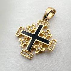 ✨ Introducing our Handmade 14k Gold Jerusalem Cross Pendant, a divine fusion of craftsmanship and symbolism. 🌟 Crafted in radiant yellow gold, this pendant showcases intricate details with Black Enamel and shimmering Cubic Zircons. Measuring 0.60x0.60 inches, it's a petite yet powerful expression of faith. 🌈 ✨ Immerse yourself in the profound religious significance of the Jerusalem Cross. Symbolizing the spread of God's word from Jerusalem to the four corners of the world, this pendant encapsu Symbolic Black Gemstone Jewelry, Symbolic Black 14k Gold Jewelry, Black Symbolic Jewelry For Anniversary, Black Symbolic Anniversary Jewelry, Symbolic Black Jewelry For Anniversary, Traditional Black Jewelry With Polished Finish, Traditional Black Hallmarked Jewelry, Black Polished Cross Jewelry, Black Symbolic Cross Pendant Jewelry