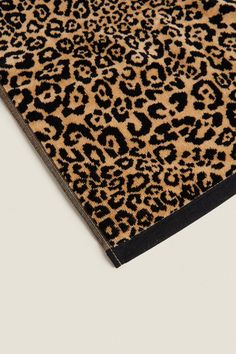 an animal print rug with black border