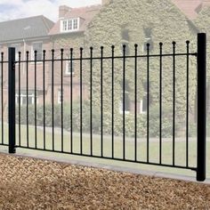 a black iron fence in front of a house