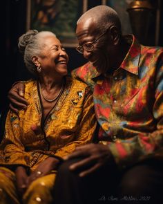 an older man and woman sitting next to each other