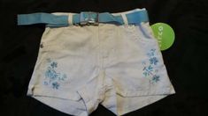 NWT ~ Circo NWT ~ Circo White Denim Jean Shorts Snap & Zipper Closure Elastic Waistband in Back Turquoise Blue Embroidered Flowers & Butterlfies Removable Turquoise Blue Belt Girl's ~ Size 12 months   Photos show the actual item you will receive.  I prefer not to use stock photos.  Please keep in mind colors may not look true on every screen.  Should you need more information such as measurements, please feel free to ask.  All items are from a SMOKE-FREE home.  Thanks a lot for looking! See my o Blue Belt, White Denim Jeans, White Denim Shorts, Denim Jean Shorts, Aesthetic Outfit, Baby & Toddler Clothing, Bottom Clothes, Denim Jean, White Denim