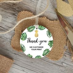 a thank you tag with tropical leaves and pineapples on it next to twine of twine