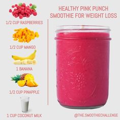 a pink smoothie in a jar with ingredients to make it into a smoothie