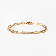 We are so excited to add a hammered textured chain to our bracelet collection!With longer links and a substantial lobster clasp, this solid 14k gold chain comes in three sizes so you can customize the fit perfectly to your wrist. It stacks beautifully with bangles and catches the light with a hammered texture. Timeless Chain Link Bracelet With Lobster Clasp, Timeless Gold Chain Bracelet For Everyday, Formal Chain Link Bracelet With Hook And Links, Minimalist Gold Link Bracelet For Everyday, Minimalist Link Gold Bracelet For Everyday Luxury, Modern 14k Gold Bracelet With Lobster Clasp, Minimalist 14k Gold Oval Link Bracelet, Gold Link Bracelet With Hook And Links, Timeless Link Chain Bracelet With Lobster Clasp