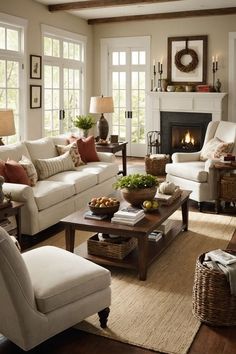 a living room filled with furniture and a fire place in the middle of a room