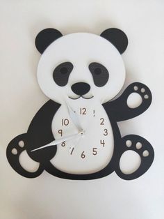 a black and white clock with a panda bear on it