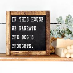 a sign that says in this house we narrate the dog's thoughts