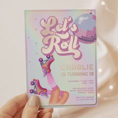 a person holding up a card that says let's roll charlie is turning 13