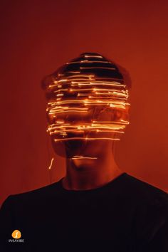 a man with his head covered in lights